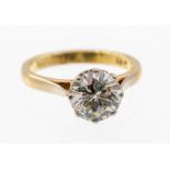 A diamond and 18ct gold solitaire, comprising a claw set round brilliant cut diamond weighing