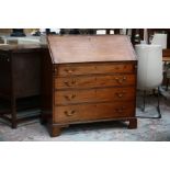 A George III mahogany bureau, circa 1780, the fall front having a fitted interior with drawers and