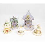 A group of five Staffordshire pottery Cottage Ornee pastille burners, graduating sizes, the