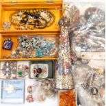 A collection of costume jewellery to include beads, paste set brooches, Scottish themed jewellery