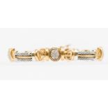 A 9ct gold and diamond bracelet, comprising oval diamond set links with alternating links of white