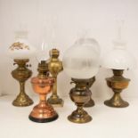 Six Brass and Copper oil lamps with funnels and shades.
