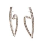 A pair of diamond set line earrings, tapered 'V' form with a reverse scroll  grain set throughout