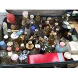 A collection of assorted perfume bottles and scent bottles, mostly glass by various brands, some mid