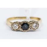 A Three Stone Diamond and Sapphire Yellow Metal Ladies Dress Ring, probably 18ct gold, set with