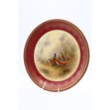 A Royal Worcester pattern no: W 7844 cabinet plate, the reserve painted with Pheasants on the wood