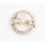 A late Victorian diamond and pearl hoop brooch, the circular form set with old cut diamonds, with