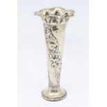 An early 20th Century Art Nouveau style silver tapering vase, flared rim, floral decoration, filled,