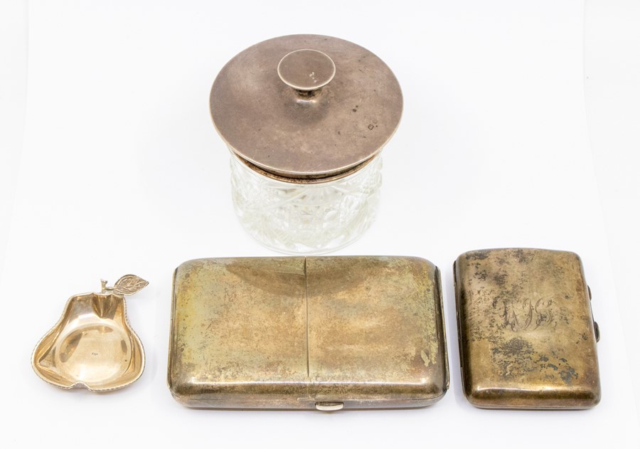 A collection of silver to include: George V cushion shaped cigarette case, hinged cover opens