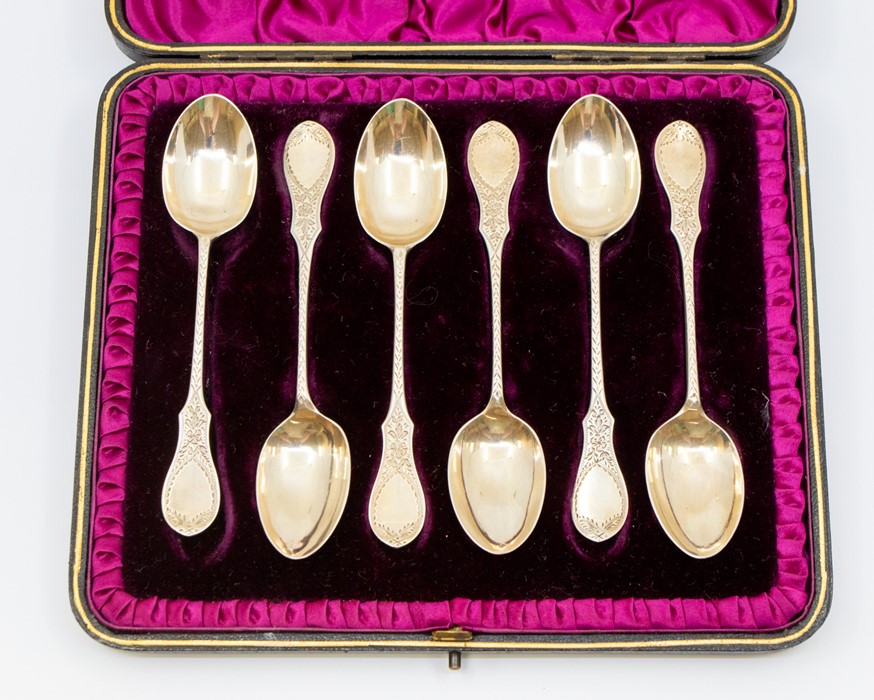 A set of six Victorian silver shaped fiddle pattern teaspoons, engraved decoration by Hilliard &