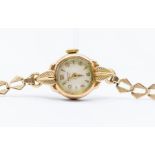 A 9ct gold Rodana 17 jewel ladies wrist watch, round dial with leaf decoration to case, on fancy 9ct