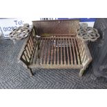 A 19th Century cast iron fire grate, moulded detail on fireback, with hinged trivets