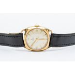 A Tudor 9ct gold gents wristwatch, windup mechanism, black leather strap, with watch guarantee &