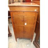 An early 20th Century mahogany electric radiogram, in a case, lift up lid section, 100cm high, 51cm