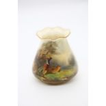 A Royal Worcester shape no: G957, wavy gilt rim, the body painted with a pair of Pheasants in