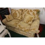 A Duresta Classic two seater settee, hand made in England, upholstered in yellow foliage pattern