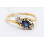 An 18ct gold sapphire and diamond three stone ring, circa 1915, size K, approx 2.5grams