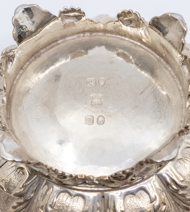 A George IV silver-gilt large circular salt, border and body chased with flowers and foliage, on - Image 2 of 3