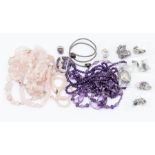 A collection of amethyst and rose quartz jewellery to include bead necklaces white metal jewellery