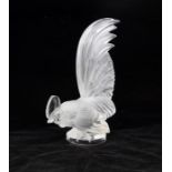 A Lalique Crystal of Paris mascot figure, frosted, signed to base edge. 21cm High.