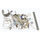 A collection of silver and white metal jewellery to include bangles, chains, pendants, earrings,