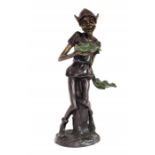 A bronzed figure / garden ornament of a Pixie holding Lily pads in the manner of David Goode,