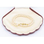 A cultured pearl single string necklace, comprising white pearls approx 5mm, length approx 16'',