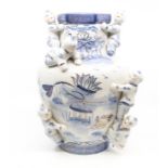 A modern Chinese blue and white vase applied with figures climbing, the body painted water