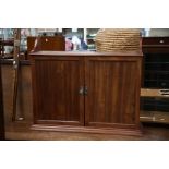 An early 20th Century mahogany wall hanging cabinet, fitted with two doors, 84cm high, 97cm wide,