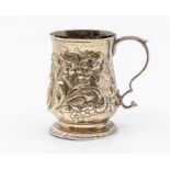 A George III silver baluster mug, chased with floral decoration, by F.C, London 1770, height