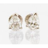 A pair of diamond pear cut studs 18ct white gold, comprising claw set pear cut diamonds, with a