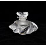A Lalique frosted and clear glass scent bottle with stopper, signed to the underside, 8cm high.