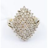 A diamond and 9ct gold cluster ring, size Q 1/2. Total gross weight approx. 6.6 grams.