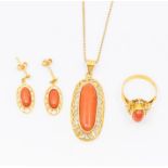 An 18ct gold and coral jewellery suite, comprising pendant, earrings and ring, the necklace set with
