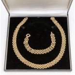 A 9ct gold chain link collar necklace, comprising a five row brick link, width approx. 12mm,  length