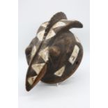 An African carved bird head piece  Provenance: from a Private collection in Scotland of a