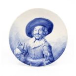 A 20th Century Dutch Delft blue and white charger, the decoration after Frans Hals with 'De Vrdyke