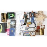 A collection of assorted curios to include Action Man figures, badges, DVDs and others. (one box)