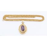 A 14K gold oval locket set synthetic sapphire with pearl border, size approx. 40 x 30mm, stamped