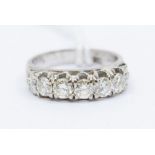 A five stone diamond and 18ct white gold ring, comprising five brilliant cut diamonds claw set in