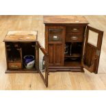 Two early 20th century oak smokers cabinets with tobacco pots and pipes. Bevelled glass and in