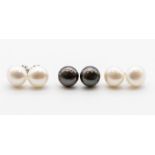 A collection of silver and cultured pearl earrings to include black and white pairs each approx.