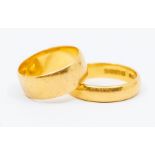 Two 22ct gold bands, width approx 7mm, size M1/2, width approx 4mm, size P1/2, weight approx 11.2