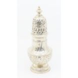 A large Victorian silver baluster shaped case, the body and pierced cover wyvern fluted with
