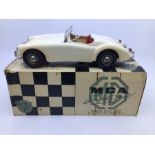 Victory: A boxed Victory Industries, Surrey, battery operated, MGA, ivory white with red interior,