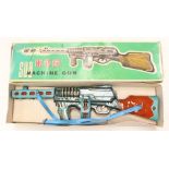 Tinplate: A boxed battery operated, tinplate, Sub Machine Gun, Made in China, untested, box in