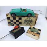 Victory: A boxed Victory Industries, Surrey, remote control, battery operated, MGA, green with tan