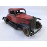 Chad Valley: A Chad Valley tinplate clockwork two door coupe. Some play/age wear. Missing steering