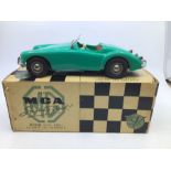 Victory: A boxed Victory Industries, Surrey, battery operated, MGA, green with brown interior,