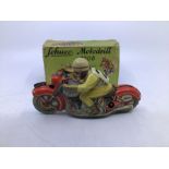 Schuco: A boxed Schuco Motodrill 1006 tinplate clockwork motorcycle. Good condition but missing